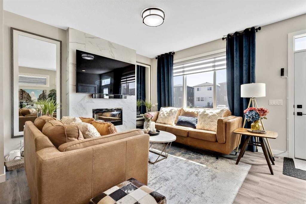 3675 Cornerstone Boulevard Ne, Calgary, AB - Indoor Photo Showing Living Room With Fireplace