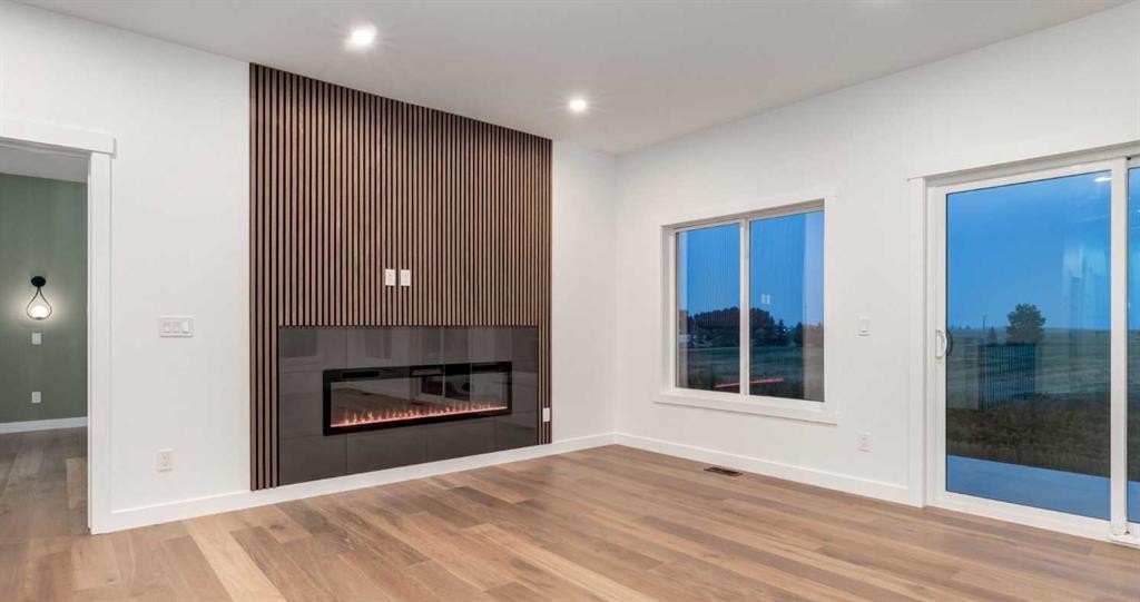 232 Red Tail Ridge Se, High River, AB - Indoor Photo Showing Living Room With Fireplace