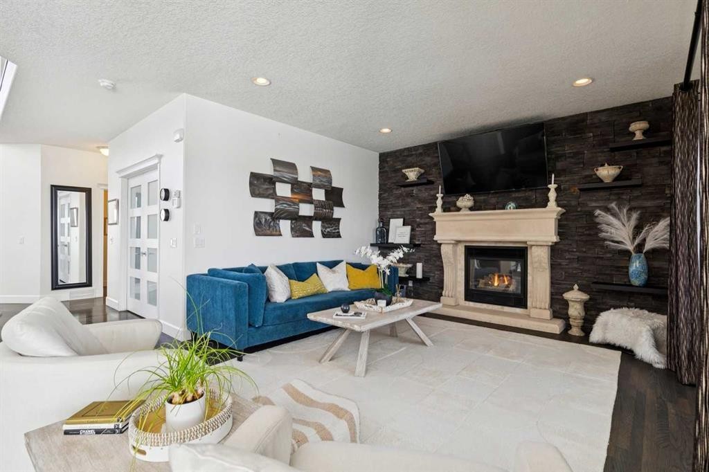 129 Mt Douglas Circle Se, Calgary, AB - Indoor Photo Showing Living Room With Fireplace