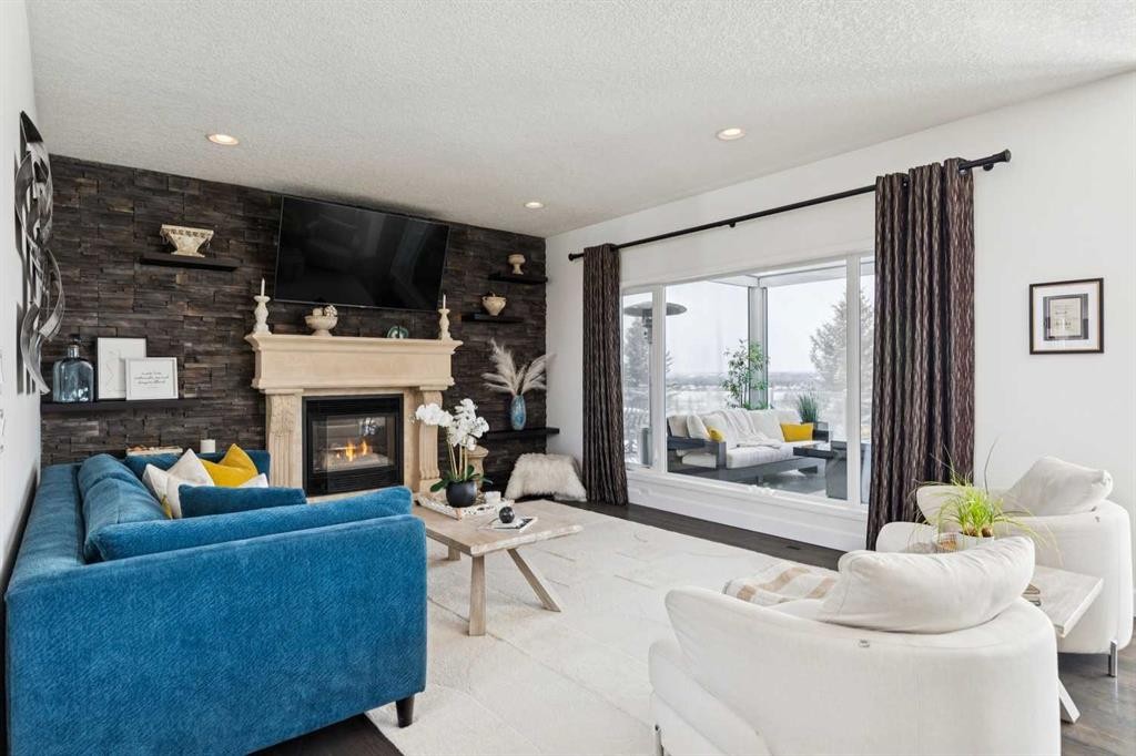 129 Mt Douglas Circle Se, Calgary, AB - Indoor Photo Showing Living Room With Fireplace