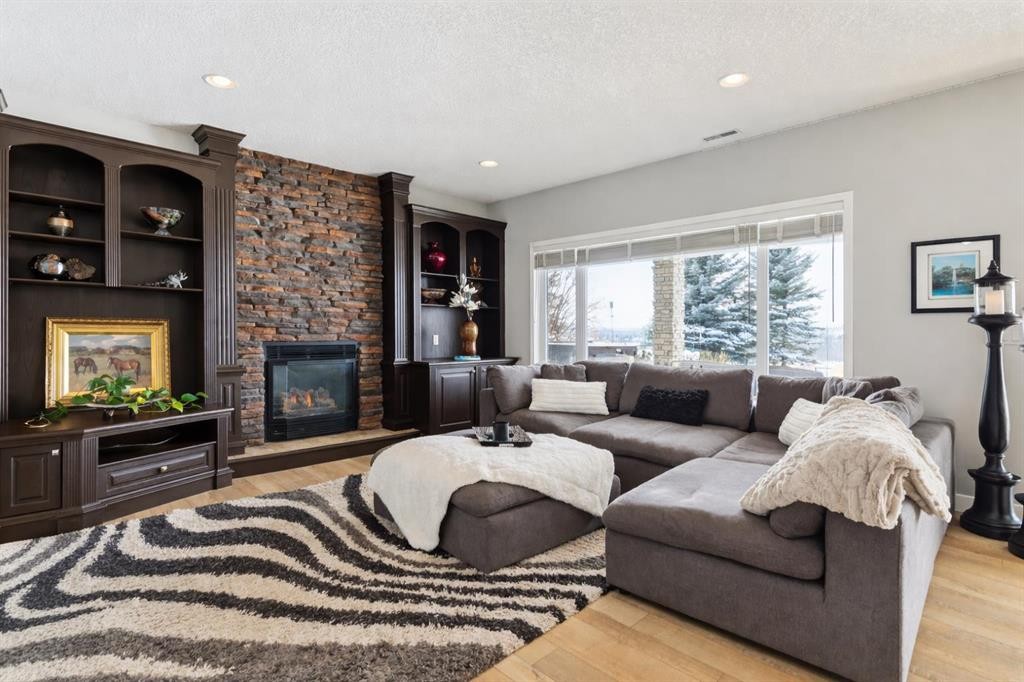 129 Mt Douglas Circle Se, Calgary, AB - Indoor Photo Showing Living Room With Fireplace