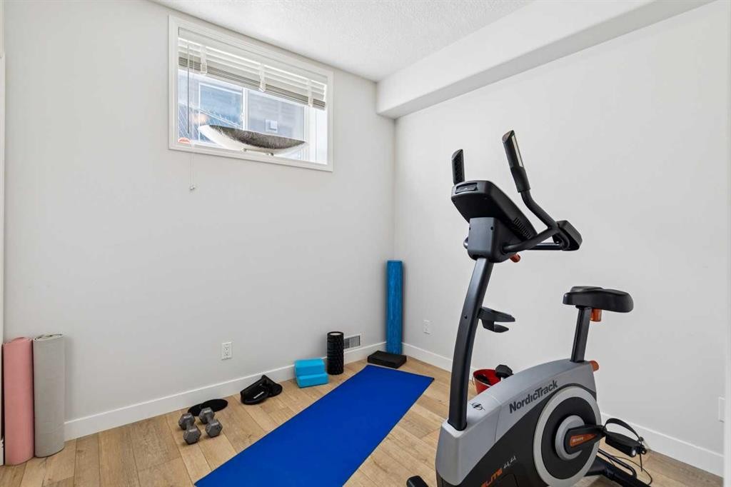 129 Mt Douglas Circle Se, Calgary, AB - Indoor Photo Showing Gym Room