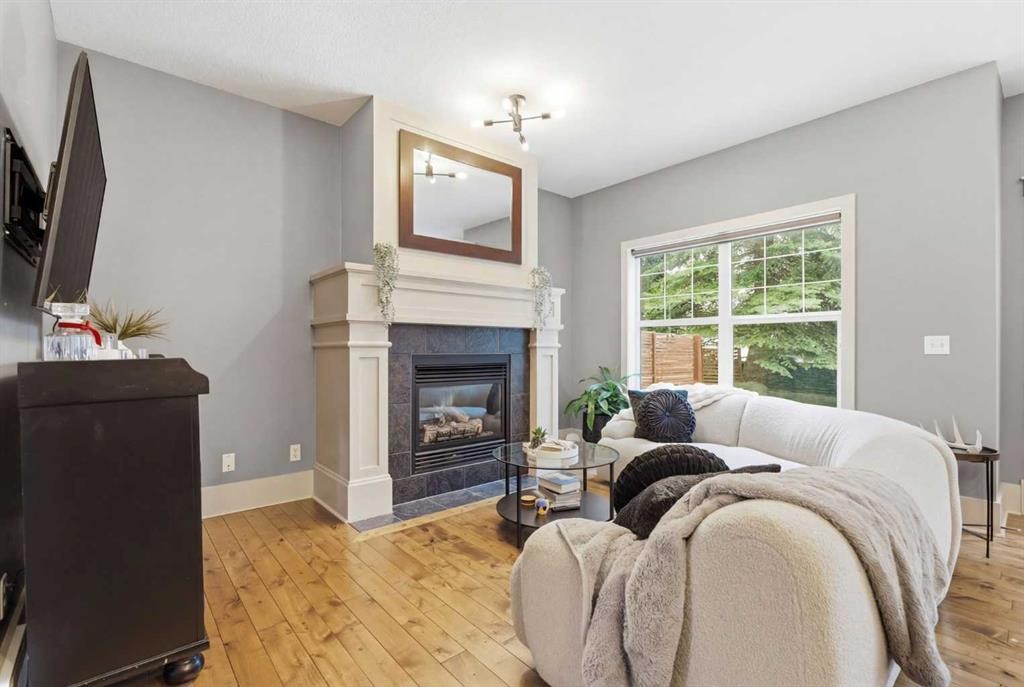 54 Wentworth Common Sw, Calgary, AB - Indoor Photo Showing Living Room With Fireplace