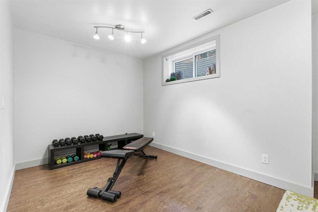 54 Wentworth Common Sw, Calgary, AB - Indoor Photo Showing Gym Room