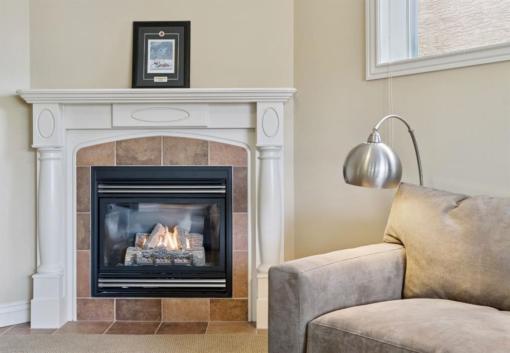 212 Springmere Place, Chestermere, AB - Indoor Photo Showing Living Room With Fireplace