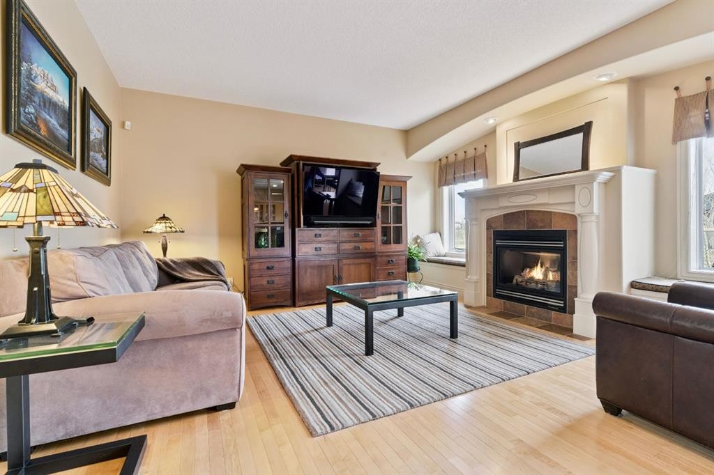 212 Springmere Place, Chestermere, AB - Indoor Photo Showing Living Room With Fireplace