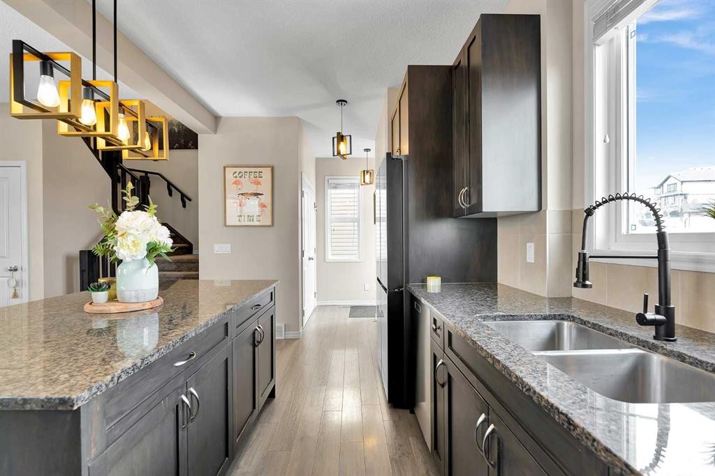 151 Heritage Drive, Cochrane, AB - Indoor Photo Showing Kitchen With Double Sink