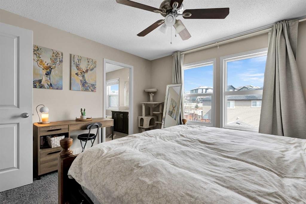 151 Heritage Drive, Cochrane, AB - Indoor Photo Showing Bedroom