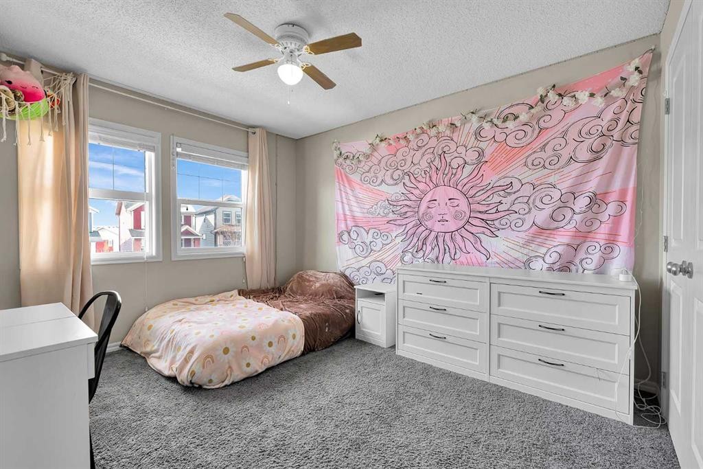 151 Heritage Drive, Cochrane, AB - Indoor Photo Showing Bedroom
