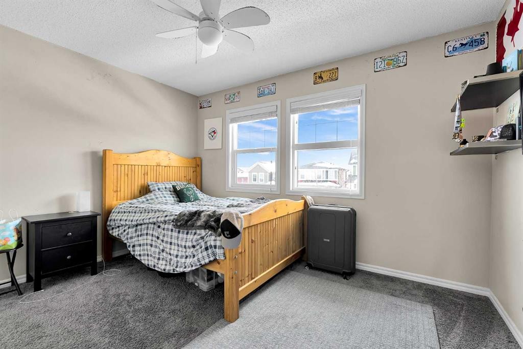 151 Heritage Drive, Cochrane, AB - Indoor Photo Showing Bedroom