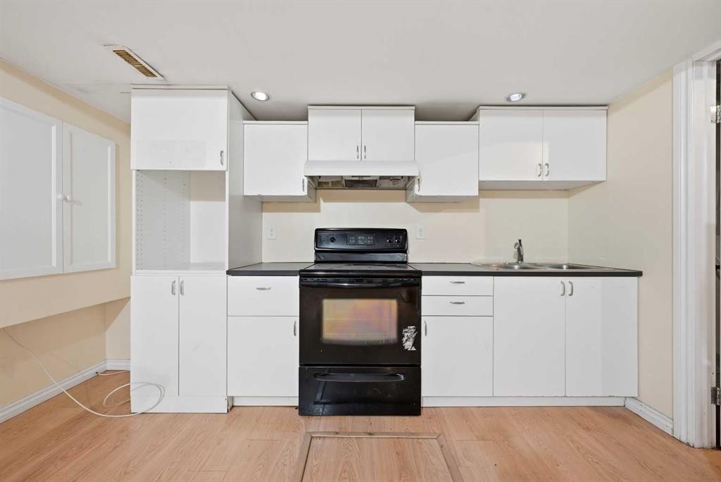 165 Saddlecrest Way Ne, Calgary, AB - Indoor Photo Showing Kitchen With Double Sink