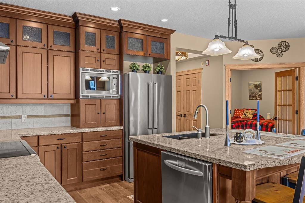 202-3 Aspen Glen, Canmore, AB - Indoor Photo Showing Kitchen With Double Sink
