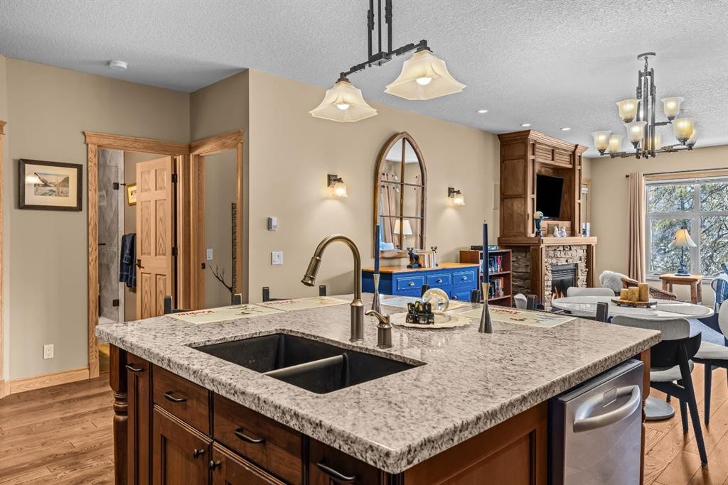 202-3 Aspen Glen, Canmore, AB - Indoor Photo Showing Kitchen With Double Sink