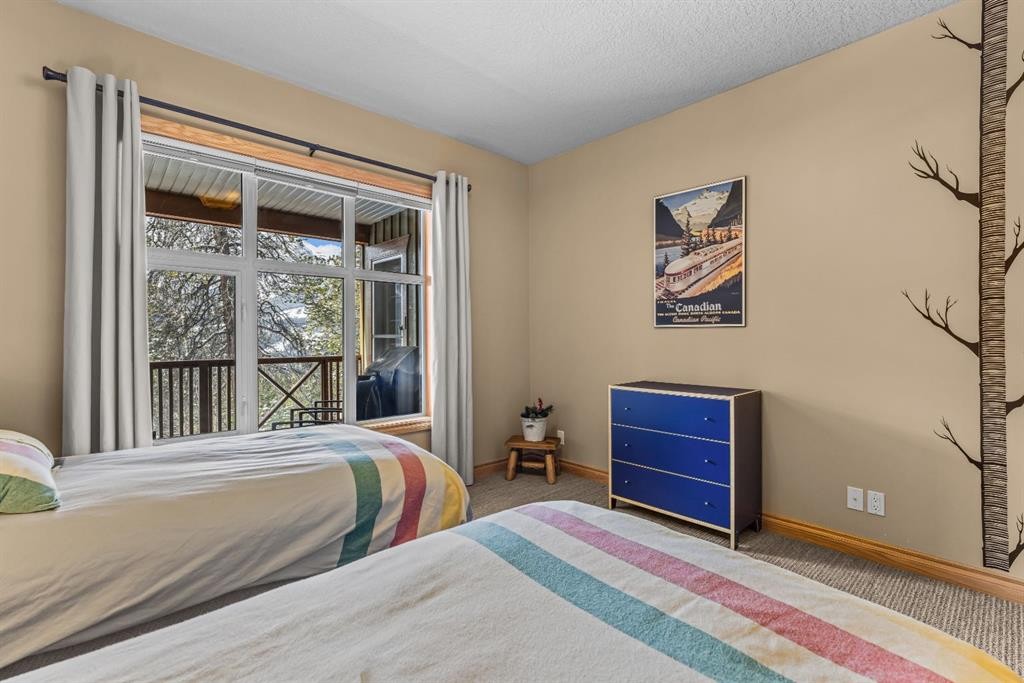 202-3 Aspen Glen, Canmore, AB - Indoor Photo Showing Bedroom