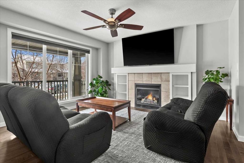 399 Copperpond Boulevard Se, Calgary, AB - Indoor Photo Showing Living Room With Fireplace