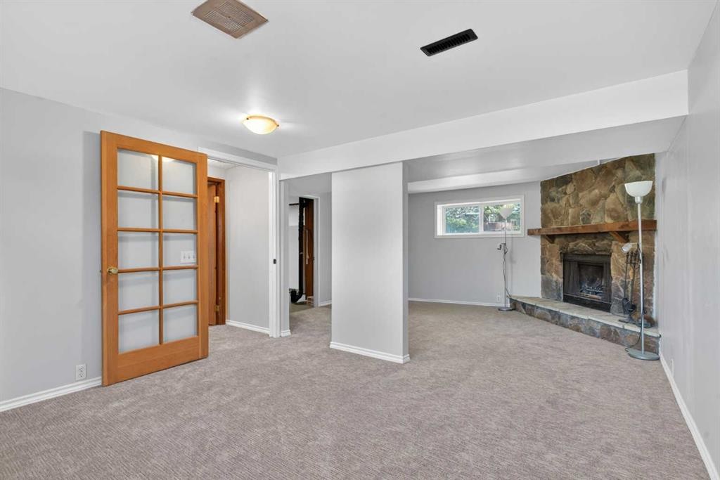 124 Lynnbrook Road Se, Calgary, AB - Indoor With Fireplace