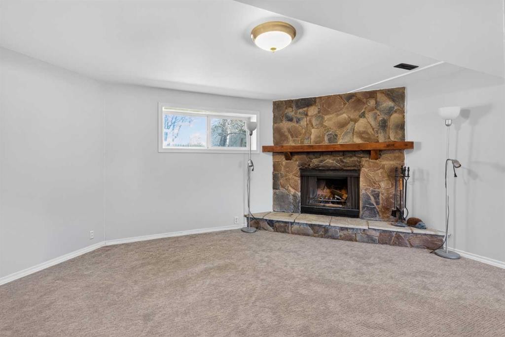 124 Lynnbrook Road Se, Calgary, AB - Indoor Photo Showing Living Room With Fireplace