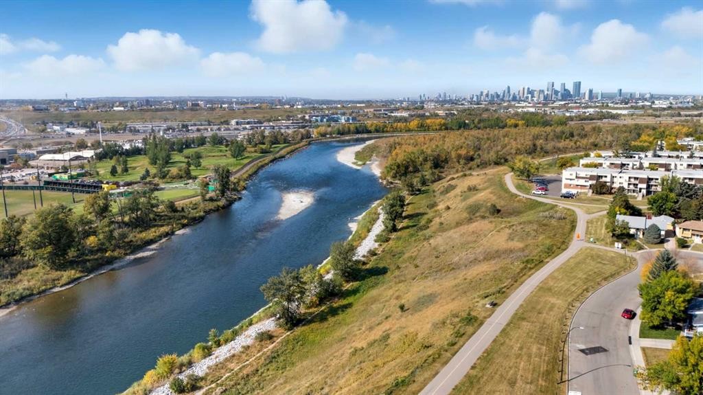 124 Lynnbrook Road Se, Calgary, AB - Outdoor With Body Of Water With View