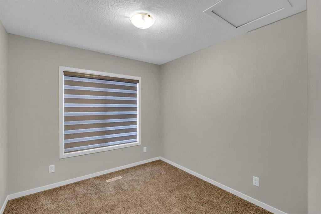 249 Aquila Drive Nw, Calgary, AB - Indoor Photo Showing Other Room