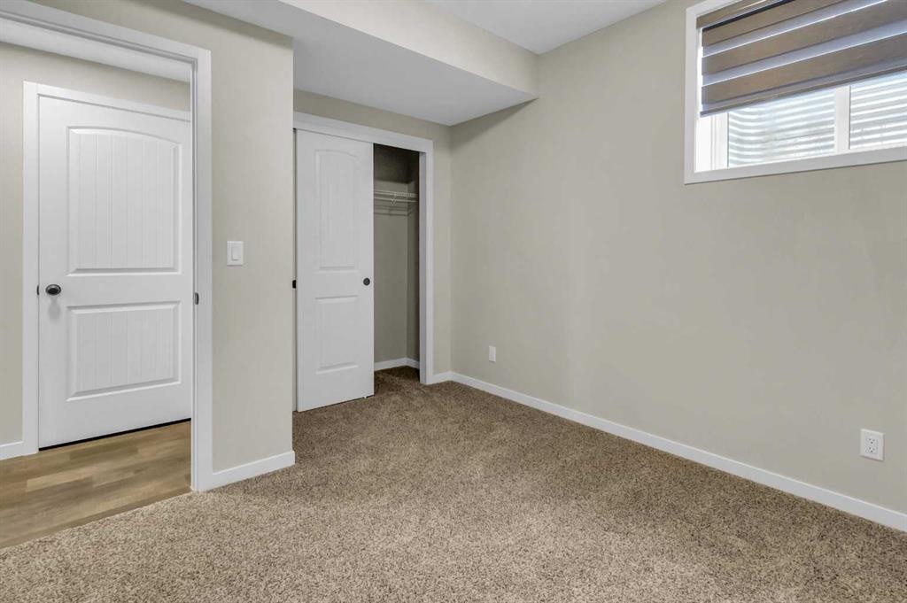 249 Aquila Drive Nw, Calgary, AB - Indoor Photo Showing Other Room