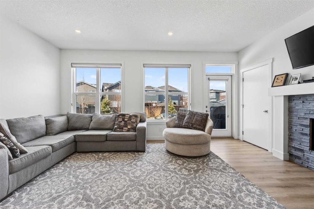83 Seton Heath Se, Calgary, AB - Indoor Photo Showing Living Room With Fireplace