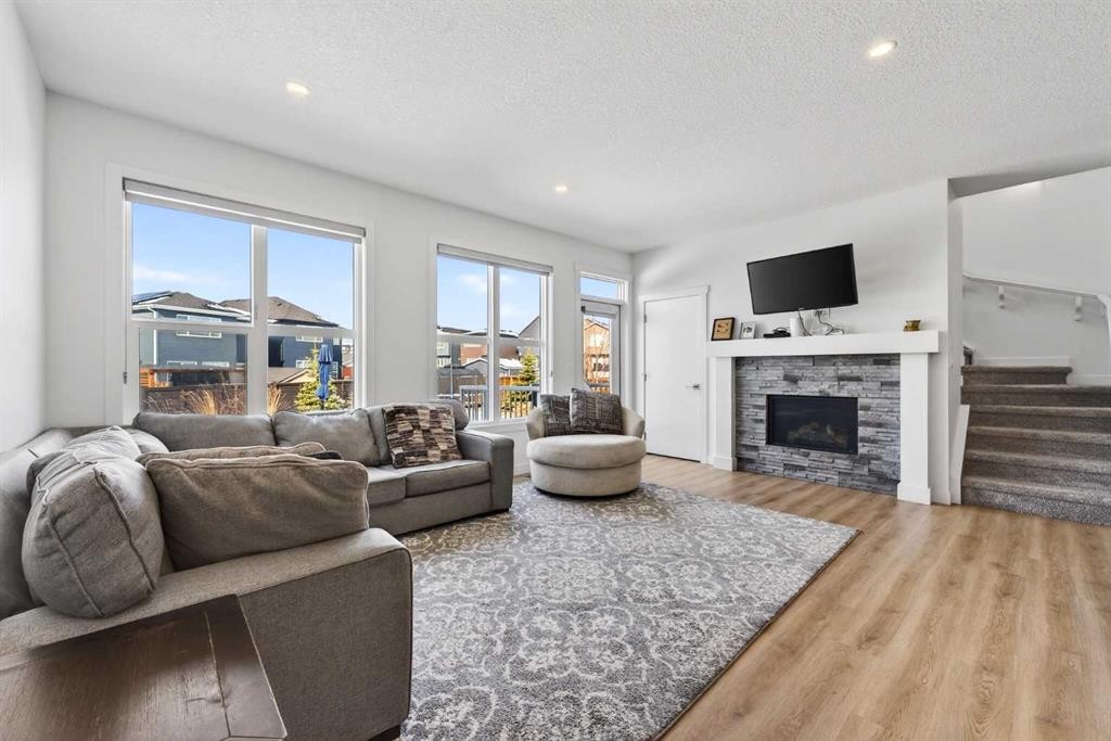 83 Seton Heath Se, Calgary, AB - Indoor Photo Showing Living Room With Fireplace