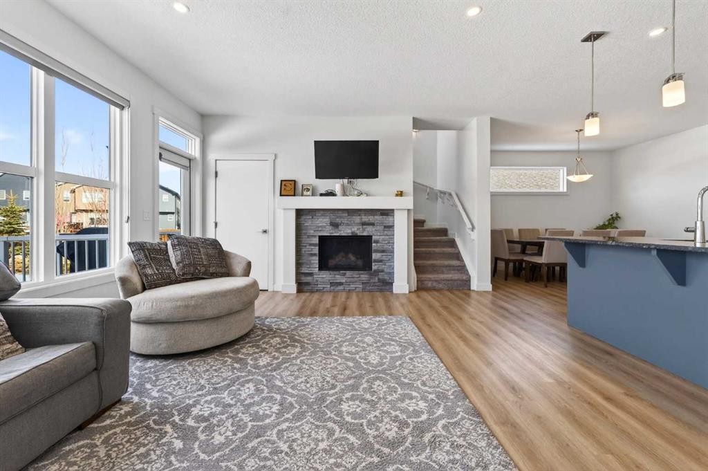 83 Seton Heath Se, Calgary, AB - Indoor Photo Showing Living Room With Fireplace