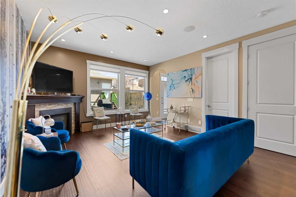 4410 17 Avenue Nw, Calgary, AB - Indoor Photo Showing Living Room With Fireplace