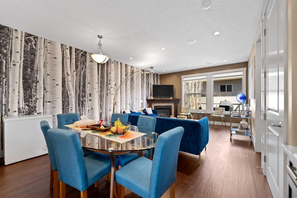 4410 17 Avenue Nw, Calgary, AB - Indoor Photo Showing Dining Room With Fireplace