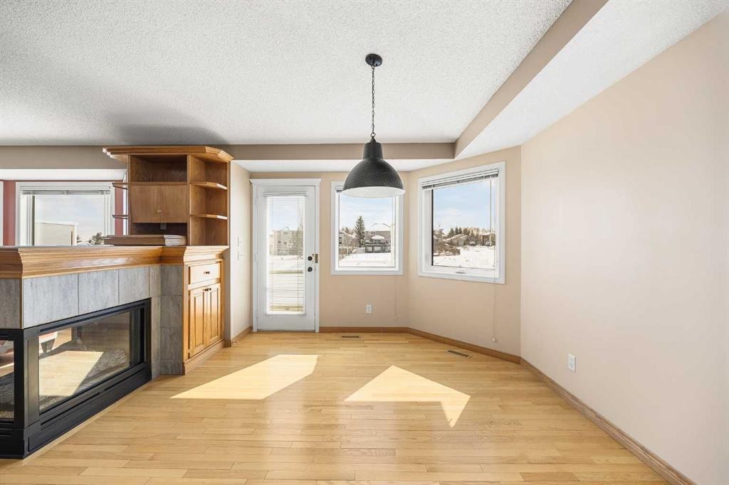 8 Edgevalley View Nw, Calgary, AB - Indoor With Fireplace