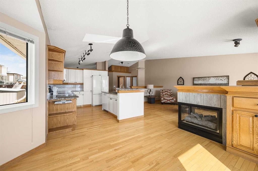 8 Edgevalley View Nw, Calgary, AB - Indoor Photo Showing Other Room With Fireplace