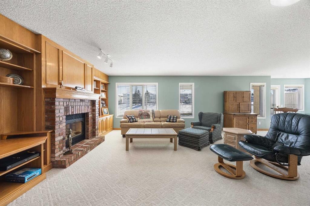 8 Edgevalley View Nw, Calgary, AB - Indoor Photo Showing Living Room With Fireplace