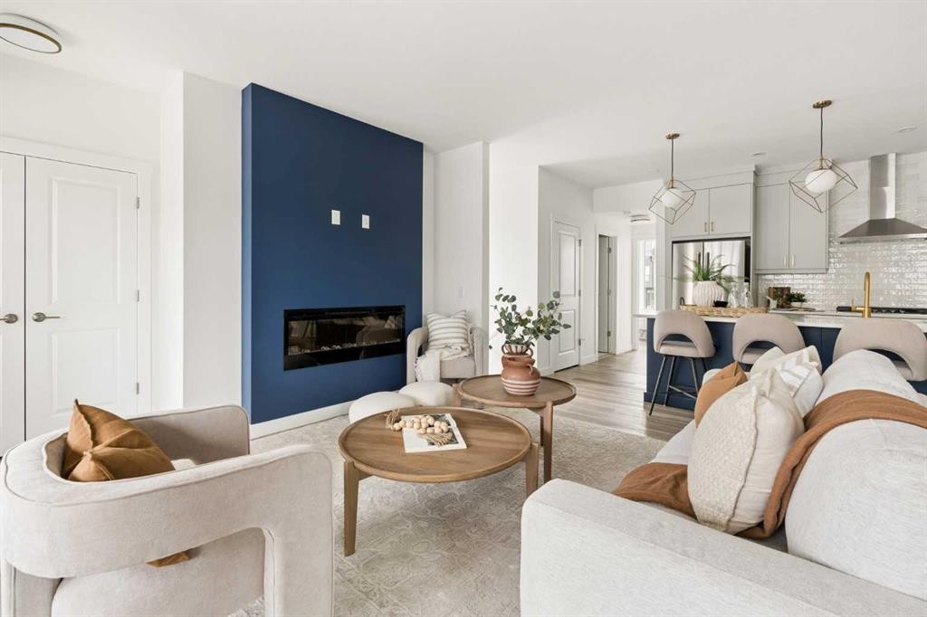605 Sovereign Common Sw, Calgary, AB - Indoor Photo Showing Living Room With Fireplace