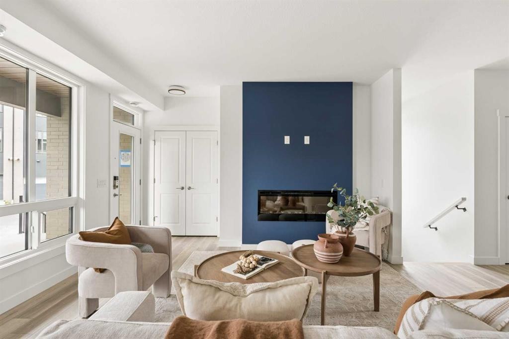 605 Sovereign Common Sw, Calgary, AB - Indoor Photo Showing Living Room With Fireplace