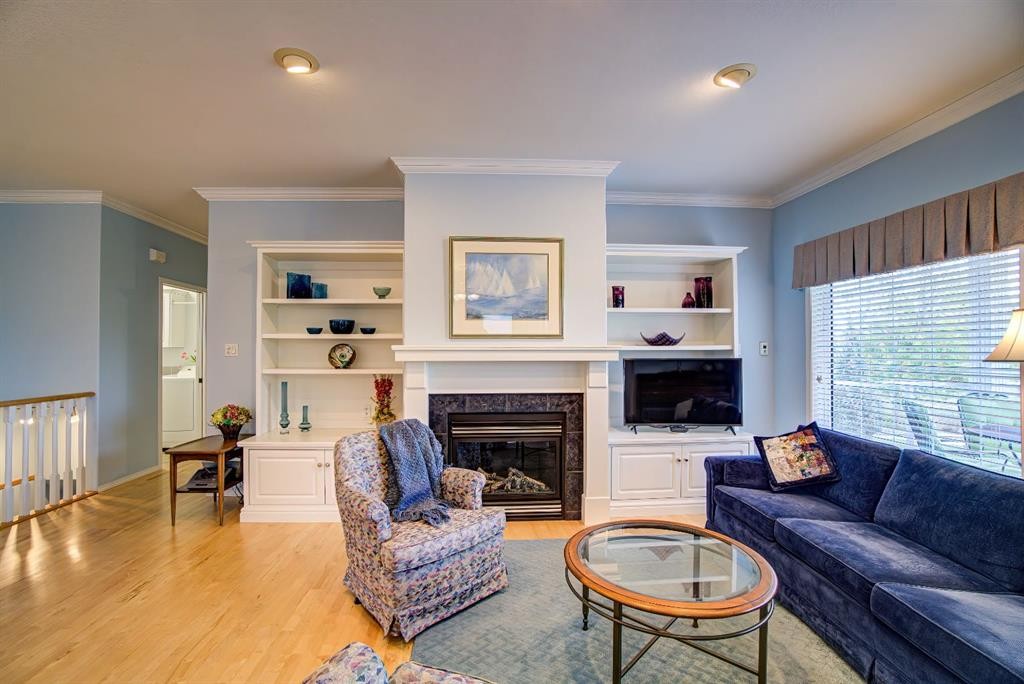 8 Link Spur, Claresholm, AB - Indoor Photo Showing Living Room With Fireplace
