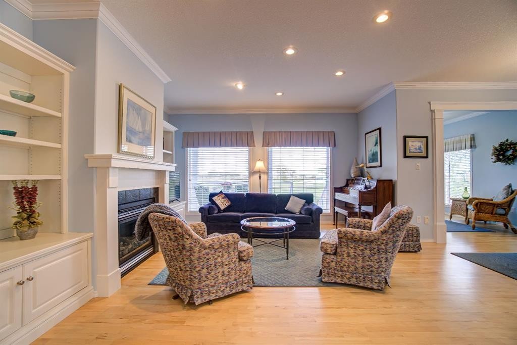 8 Link Spur, Claresholm, AB - Indoor Photo Showing Living Room With Fireplace