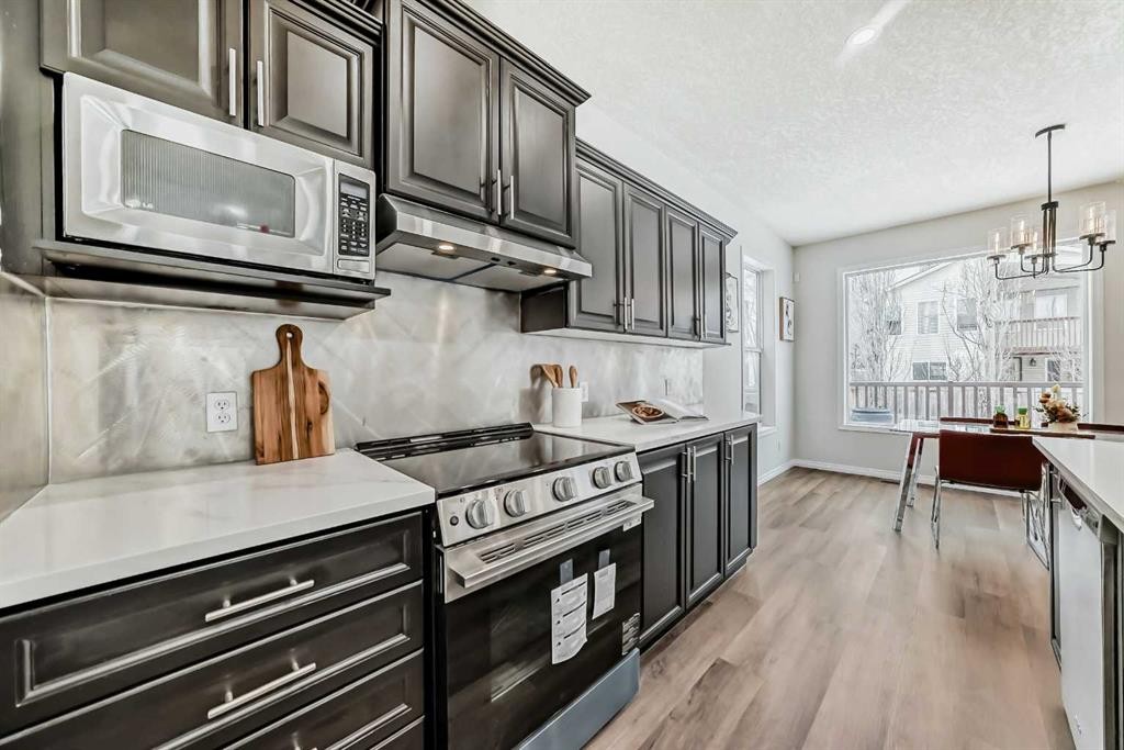 21 Panamount Row Nw, Calgary, AB - Indoor Photo Showing Kitchen With Stainless Steel Kitchen With Upgraded Kitchen