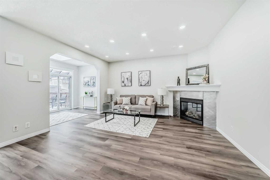 21 Panamount Row Nw, Calgary, AB - Indoor Photo Showing Living Room With Fireplace
