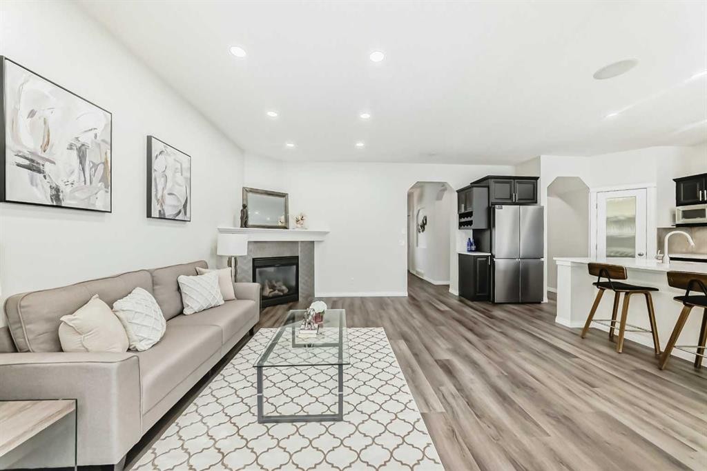 21 Panamount Row Nw, Calgary, AB - Indoor Photo Showing Other Room With Fireplace