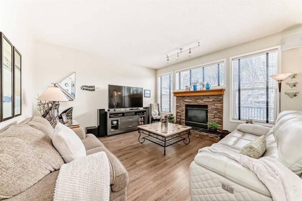 42 Somerset Circle Sw, Calgary, AB - Indoor Photo Showing Living Room With Fireplace