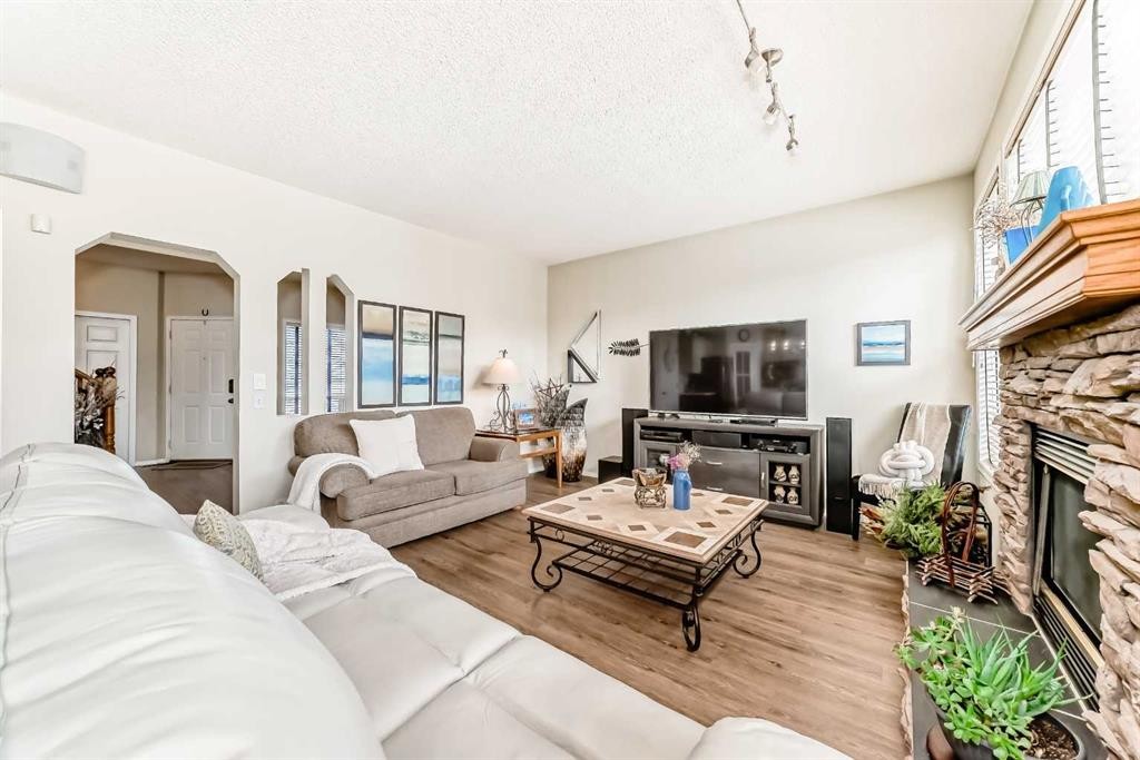 42 Somerset Circle Sw, Calgary, AB - Indoor Photo Showing Living Room With Fireplace