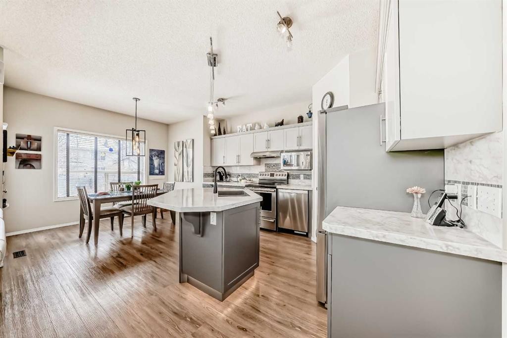 42 Somerset Circle Sw, Calgary, AB - Indoor Photo Showing Kitchen With Stainless Steel Kitchen With Upgraded Kitchen