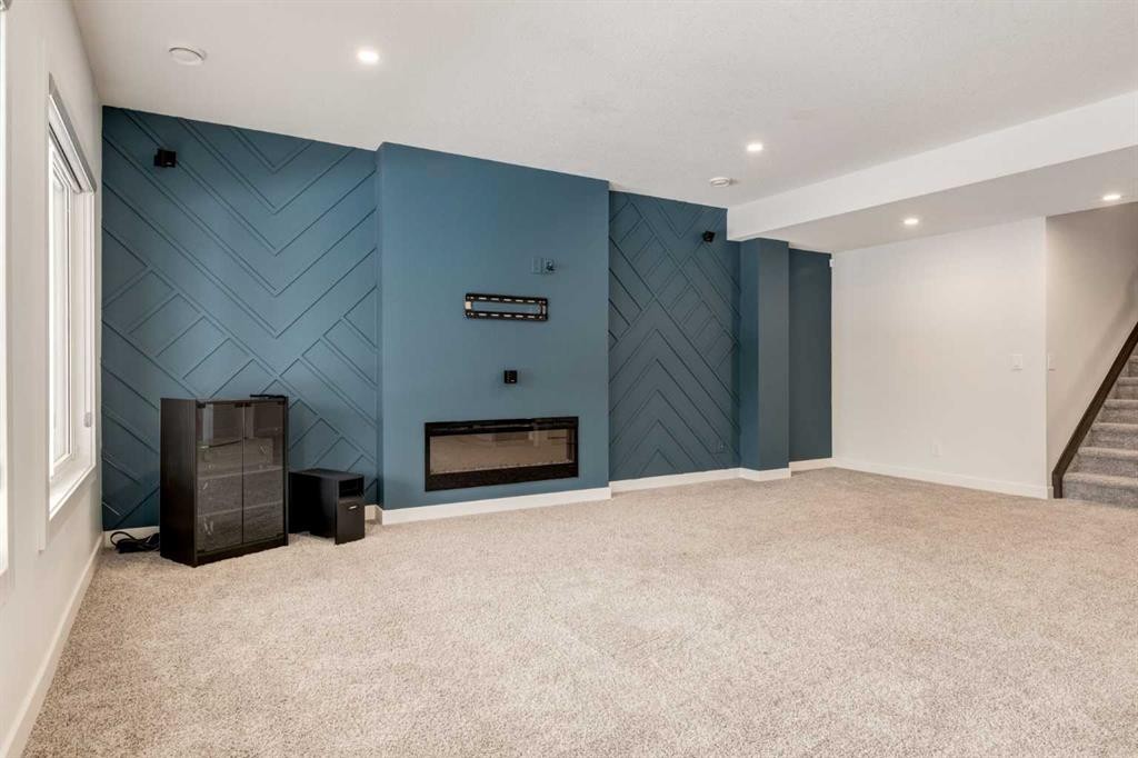 142 Cranbrook Park Se, Calgary, AB - Indoor With Fireplace