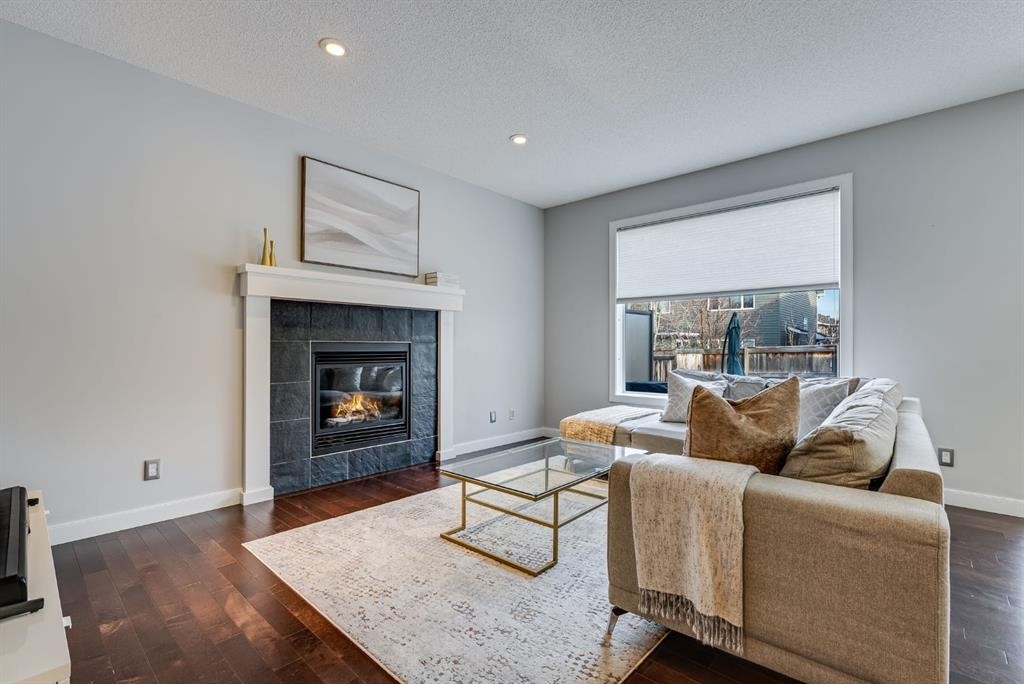 26 Auburn Glen Circle Se, Calgary, AB - Indoor Photo Showing Living Room With Fireplace