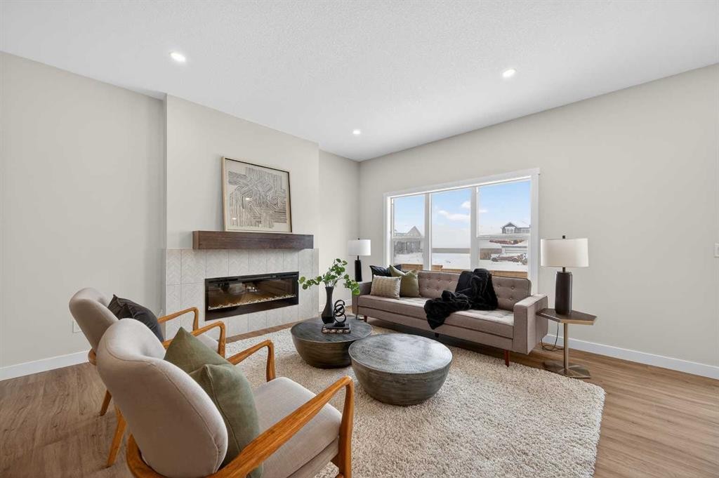 36 Lewiston Common Ne, Calgary, AB - Indoor Photo Showing Living Room With Fireplace