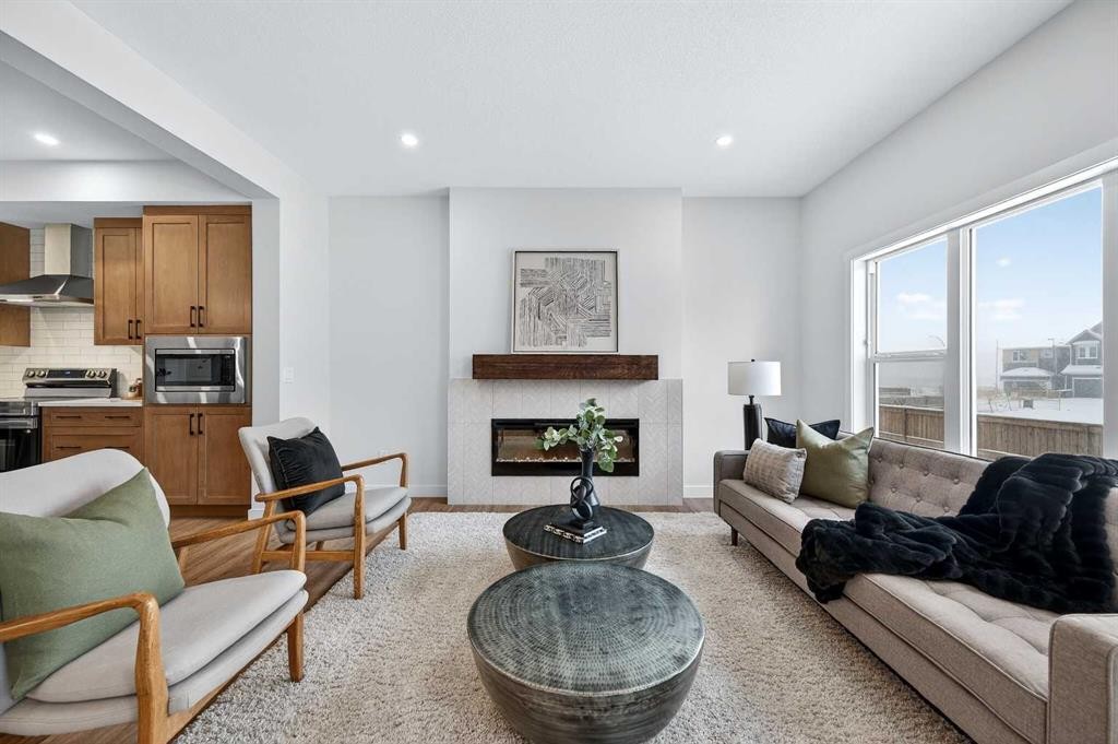 36 Lewiston Common Ne, Calgary, AB - Indoor Photo Showing Living Room With Fireplace