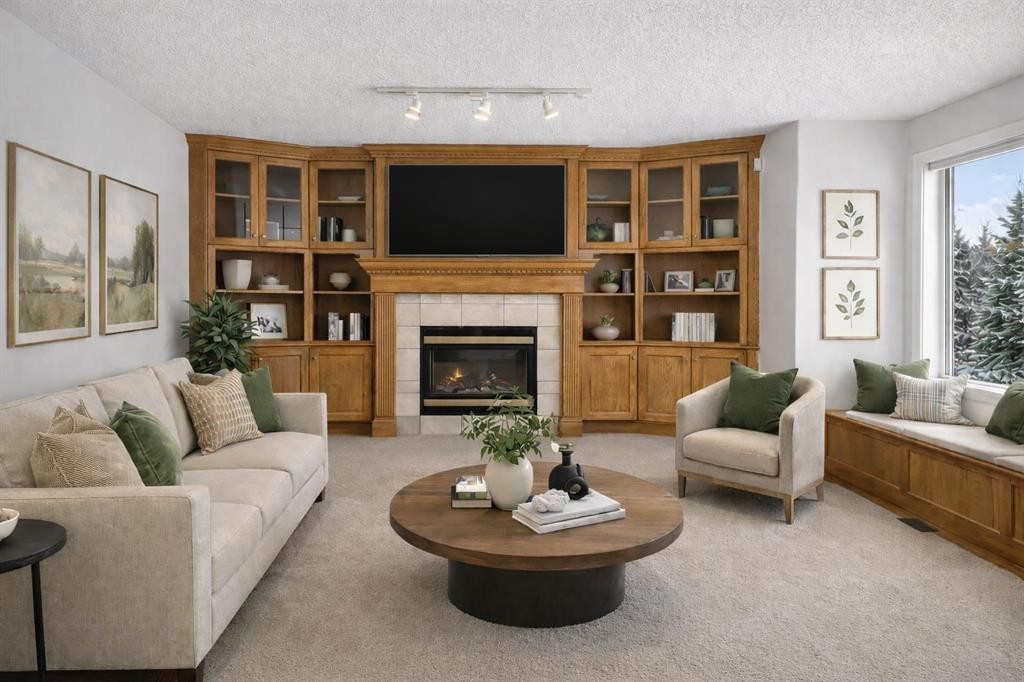 255 Hamptons Terrace Nw, Calgary, AB - Indoor Photo Showing Living Room With Fireplace