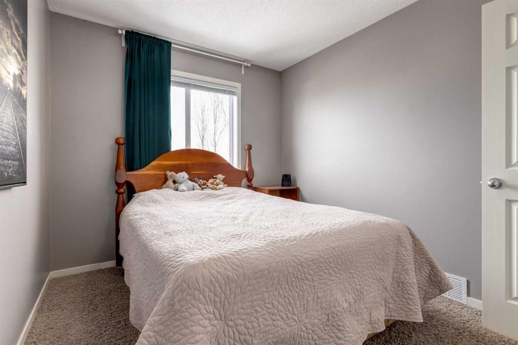 138 Cranberry Place Se, Calgary, AB - Indoor Photo Showing Bedroom