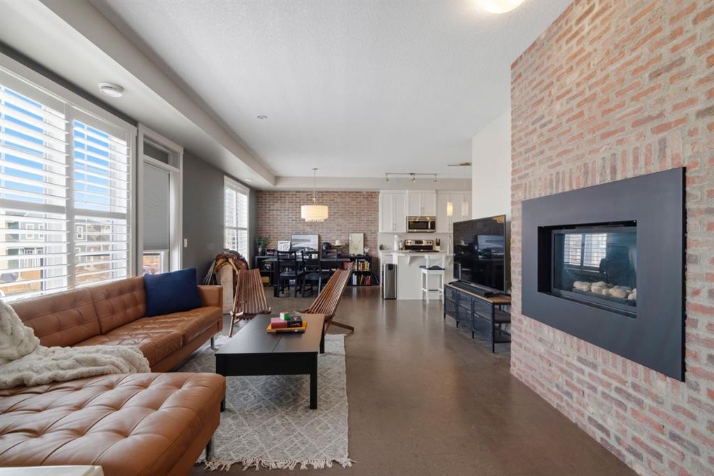 237 Mckenzie Towne Link Se, Calgary, AB - Indoor Photo Showing Living Room With Fireplace