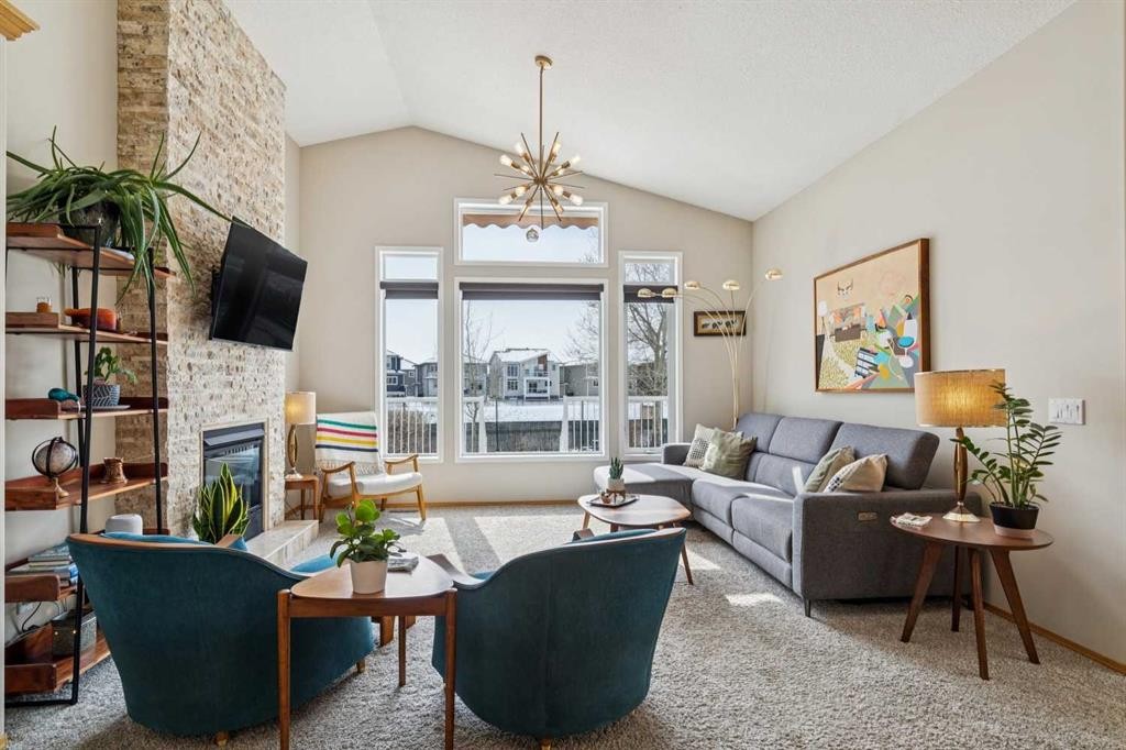 113 Westchester Way, Chestermere, AB - Indoor Photo Showing Living Room With Fireplace